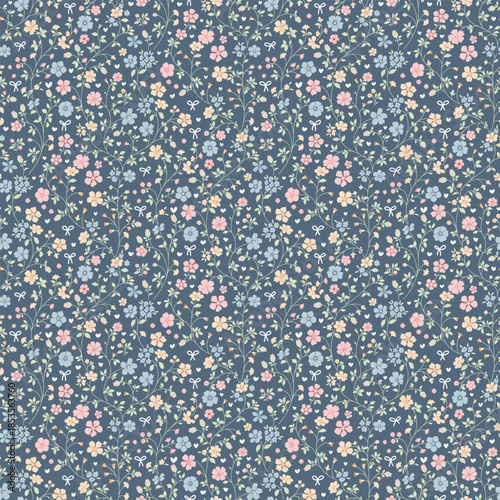 Cute Floral pattern in the small flower. Floral ditsy print. Gentle flower seamless pattern. Pretty mini plants on blue field. Botanical design textile texture. Tiny colorful flowers on blue backgroun