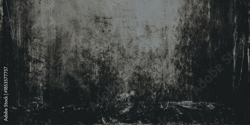 A grayscale image depicts a dense textured forest scene with blurred trees and dark shadowy undergrowth