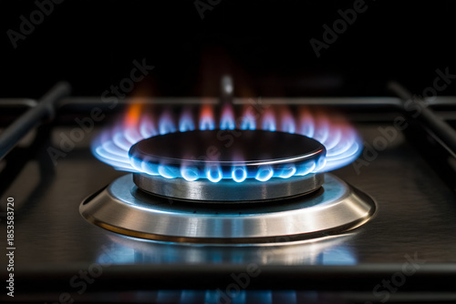 Close-up of a gas stovetop burner with vibrant flames