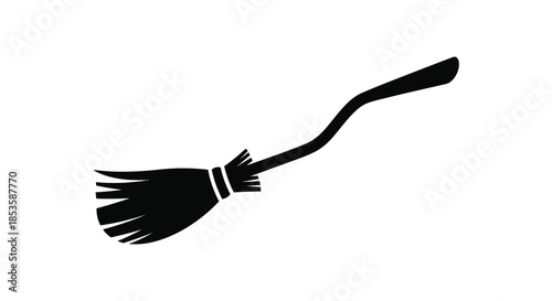 A striking black witch s broom depicted in a minimalist style a captivating dark silhouette