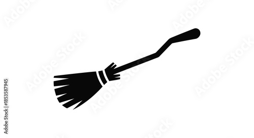 A simple black silhouette of a classic witch s broom angled diagonally across a white backdrop silhouette