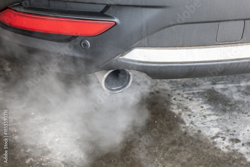 Car exhaust pipe with car idling in Winter