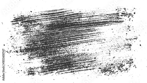 Dark gray brush stroke texture with scattered speckles on white background abstract black brushstroke