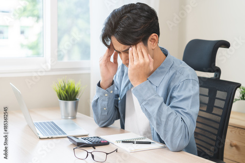 Schilderij op canvas Stressed, exhausted asian young man pain from vertigo, male having migraine symptoms headache, feel unhealthy, suffering from dizziness, holding head with hand