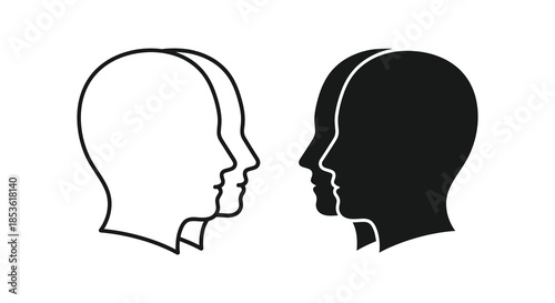 Two human head profiles facing each other one light and one dark a striking silhouette