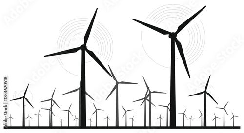 A field of wind turbines gracefully turning against a bright circular backdrop silhouette
