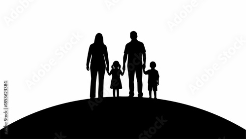 Silhouette of a family standing together on a hill.
