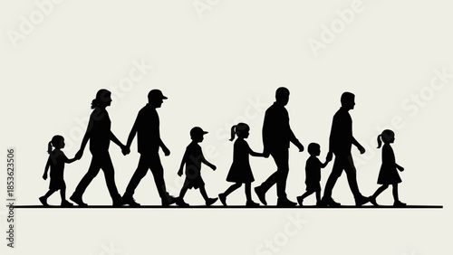 Silhouette of a large family walking together holding hands.