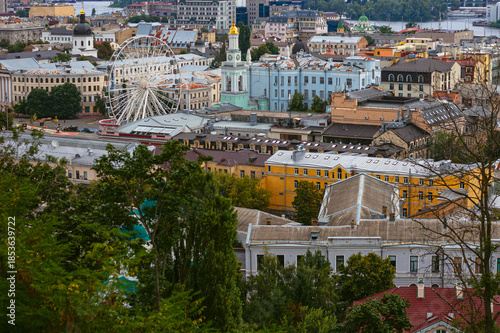 Panoramic shot of Podil in Kyiv from Andriyivskyy Descent highlighting Kontraktova Square Ferris wheel