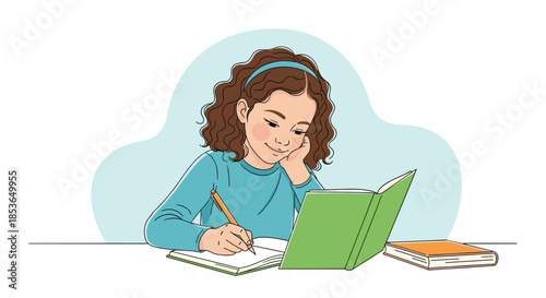 Smiling young girl with curly brown hair sitting at a desk and doing her homework, writing in a notebook with a pencil.