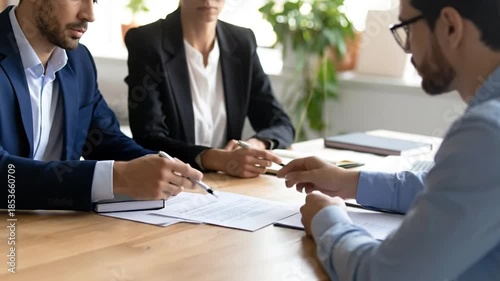 Business Team Reviewing Documents at Office Meeting