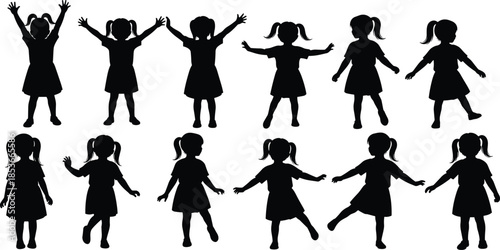 Set of black vector silhouettes of happy little girls in dresses dancing and playing isolated on a white background
