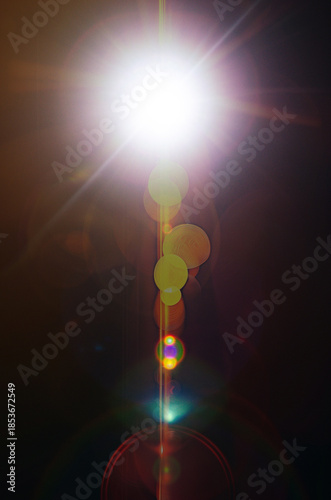 Abstract Natural Sun flare or Far star on the black background