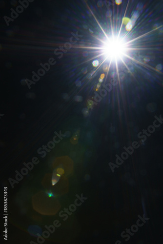 Abstract imitation sun starlight distant galaxy on a black background.