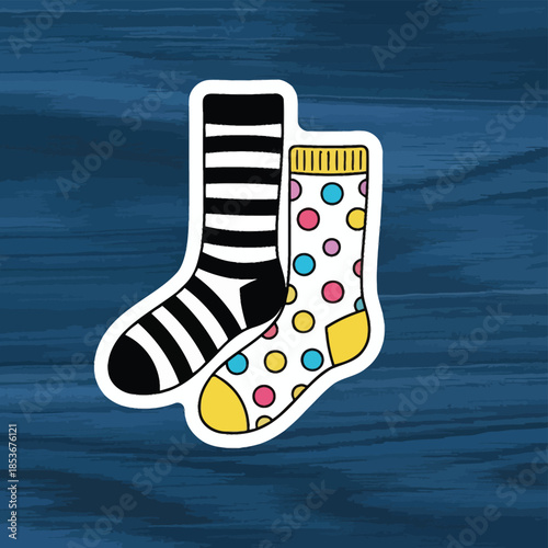 Pair of colorful socks on a wooden background