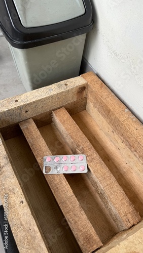 Pink Pills Blister Pack on Wooden Pallet