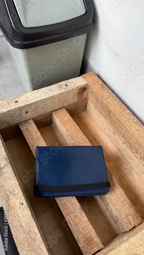 Blue Wallet on Rustic Wooden Pallet