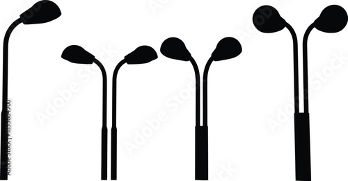 Black silhouettes of golf clubs on white background