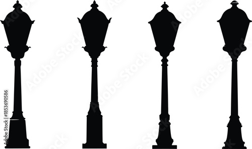 Silhouettes of four street lamp posts in a row
