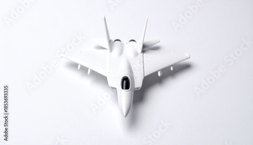 Sleek White Toy Fighter Jet on Clean White Background.
