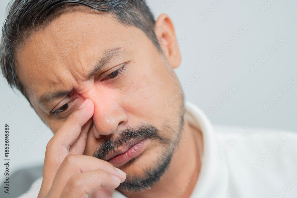 Obraz premium Man, nose and sinus pain with closeup for health, inflammation and sinusitis by allergy.