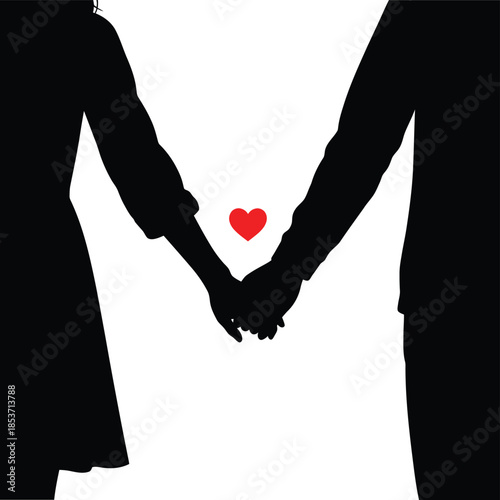 Couple holding hands with small red heart showing intimate bond