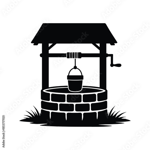 Black silhouette of water well with bucket
