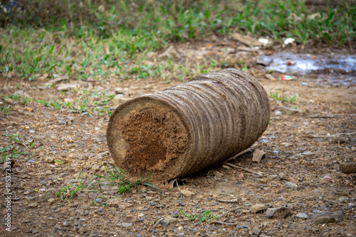 Rustic wooden stump seat outdoors on natural ground