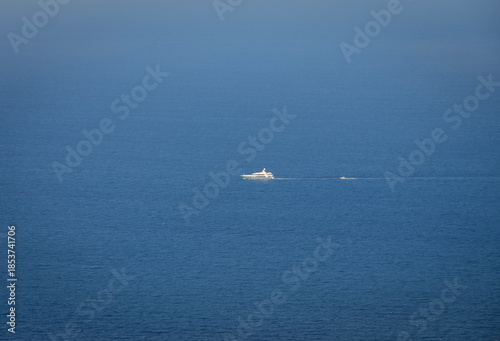 Boat Sailing Through Endless Blue Ocean in the Andaman Sea, India
