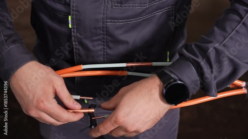 Licensed Electrician Carefully Measures And Arranges Wiring To Ensure Secure And Effective Installation