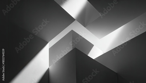A grayscale, geometric abstract featuring contrasting light and shadow on intersecting planes