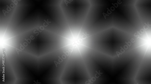 White kaleidoscope glowing light pattern on dark background animation. illumination light.