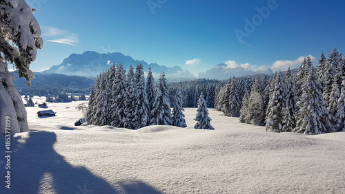 Spectacular winter scenery in the Bavarian Alps with snow-covered peaks and pristine alpine wilderness.
