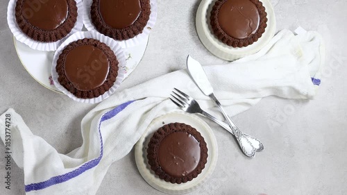Chocolate Cake with Rich Ganache On White Plates For Elegant Dessert Table