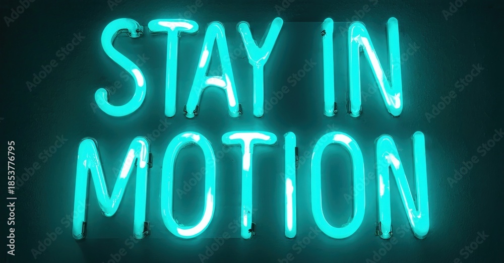 Fototapeta premium Bright turquoise neon sign displays text Stay In Motion against dark wall. Simple, modern aesthetic. Inspiring message.