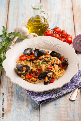 spaghetti with mussels tomatoes and parsley