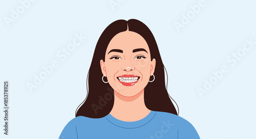 Portrait of a joyful young woman with long dark hair smiling broadly to show her teeth with orthodontic braces against a soft blue background light.
