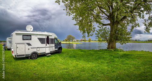 Recreational vehicle parking by the water in Maasbommel