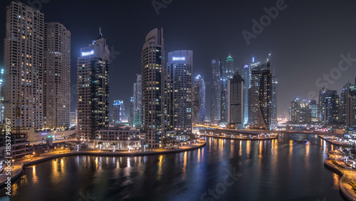 Beautiful aerial top view day to night transition timelapse of Dubai Marina canal