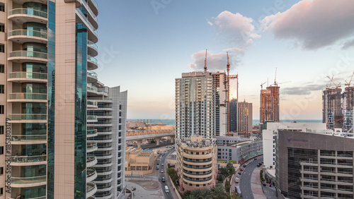 Photos Dubai Marina skyscrapers and promenade aerial night to day timelapse, Dubai, Uni