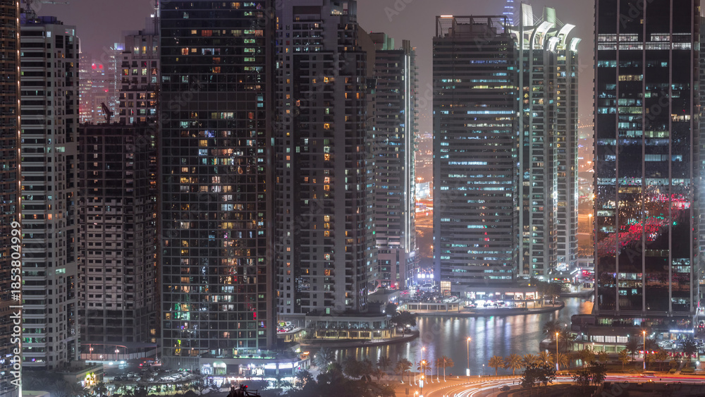 Naklejka premium Residential and office buildings in Jumeirah lake towers district day to night timelapse in Dubai