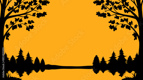 Silhouette of trees and forest reflecting in water against a golden yellow background landscape view