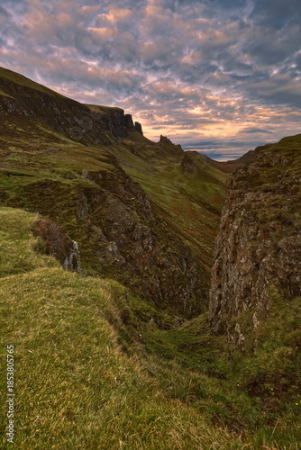 The Quiraing landform below Meall na Suiramach crest with (L-R) The Needle and The Prison rocks, Cnoc a Mhèirlich and Dùn Mòr hills. Skye-Scotland-184