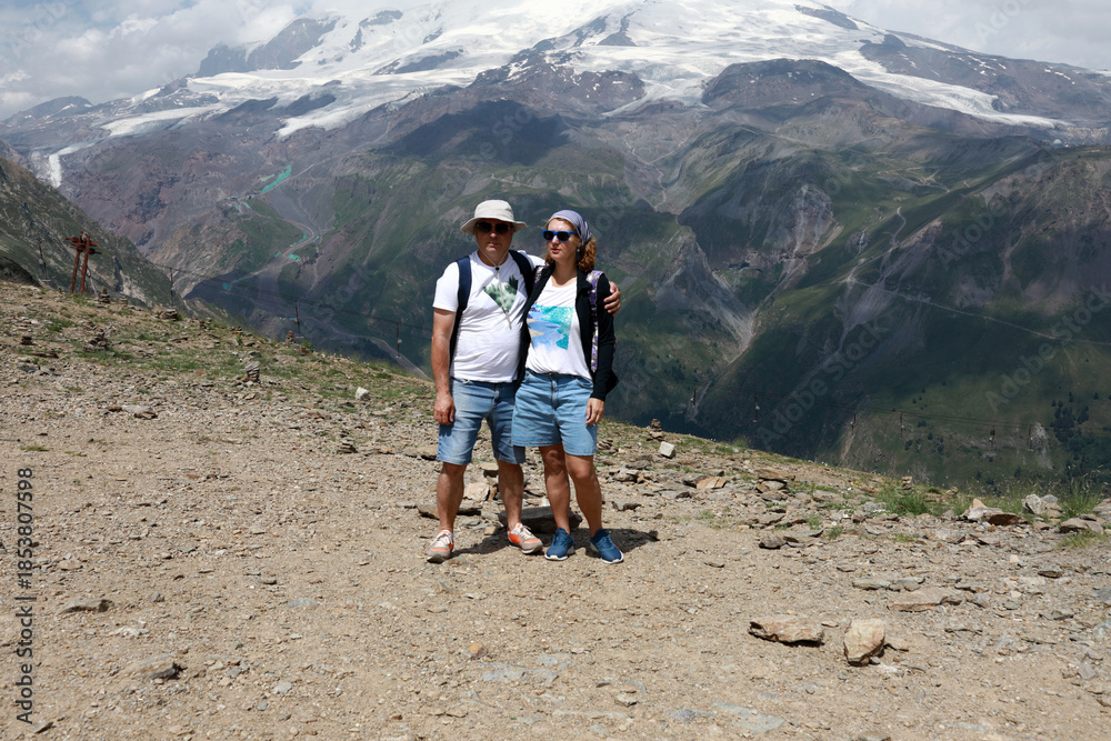 Fototapeta premium Man and woman enjoying adventure in Mount Cheget