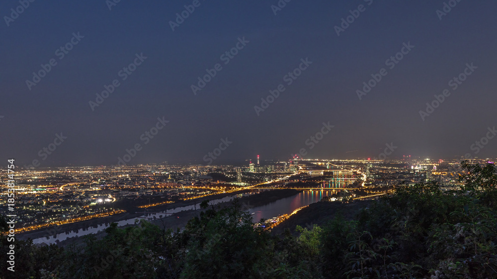 Naklejka premium Skyline of Vienna from Danube Viewpoint Leopoldsberg aerial day to night timelapse.