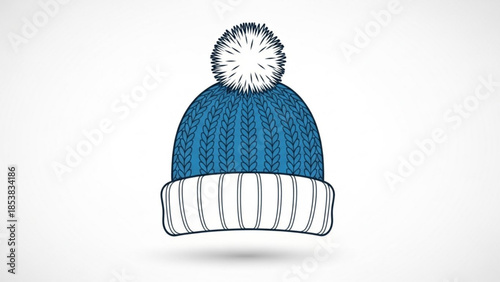 A blue knit beanie with white pom pom and ribbed cuff isolated on white background