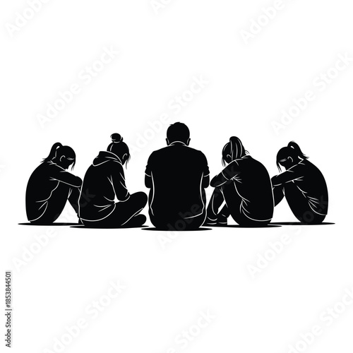 Group of people sitting in a circle heads down in silhouette
