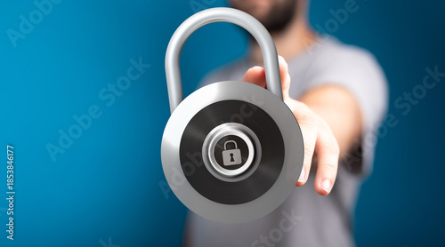 Fotografija Secure concept represented by a person holding a lock