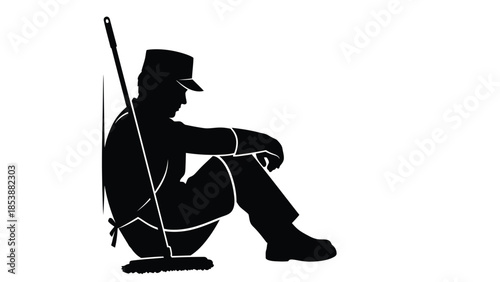 Silhouette of a tired custodian or janitor taking a necessary break while leaning against a wall