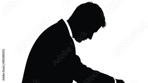 Exhausted man sitting alone with head down showing deep sadness silhouette